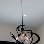 black chandelier hanging from ceiling