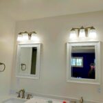 bathroom double vanity lights above mirrors