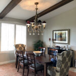 chandelier above dining table